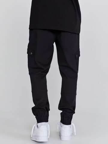 Effilé Pantalon cargo SikSilk en noir