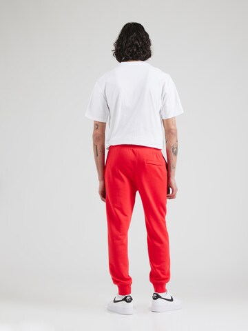 Nike Sportswear Tapered Trousers 'Club Fleece' in Red