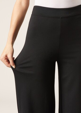 CALZEDONIA Flared Pants in Black