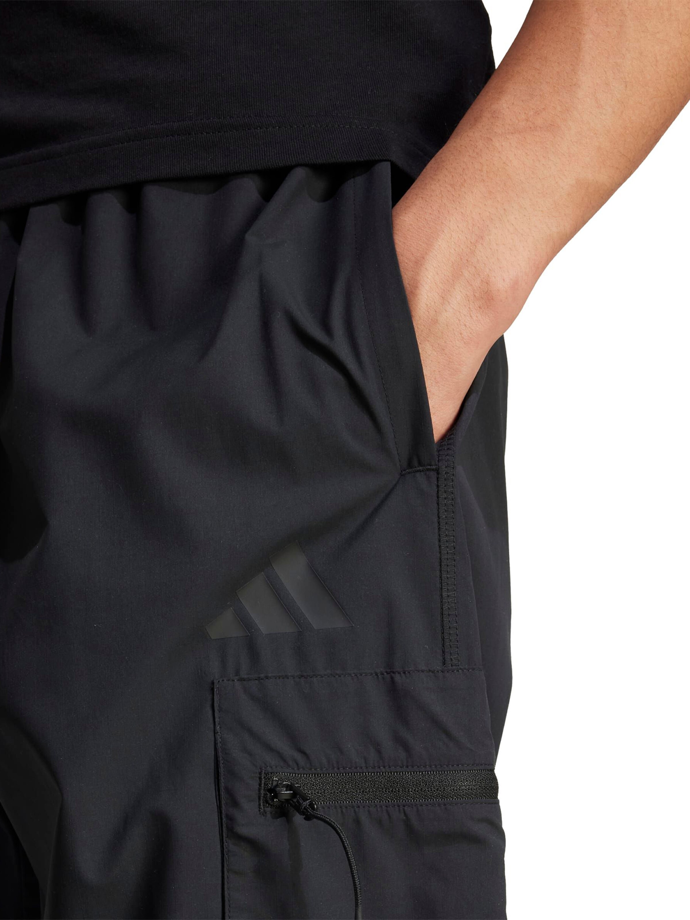 Regular Pantaloni sport 'City Escape' de la ADIDAS SPORTSWEAR pe negru