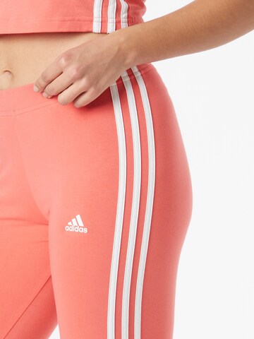 ADIDAS SPORTSWEAR Slimfit Spodnie sportowe w kolorze pomarańczowy