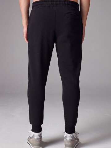 Tapered Pantaloni di Next in blu