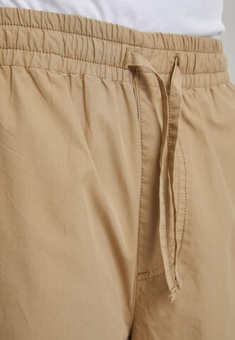 Loosefit Pantaloni di Urban Classics in beige: frontale