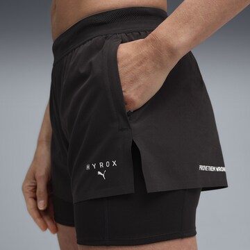 PUMA Skinny Sports trousers in Black