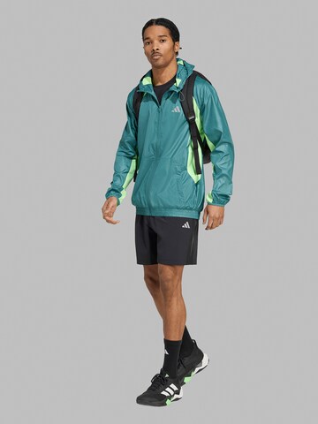 ADIDAS PERFORMANCE Loosefit Urheiluhousut 'Tech Apparel' värissä musta