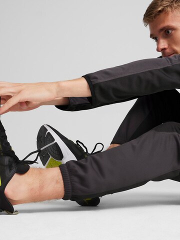 PUMA Zúžený Sportovní kalhoty 'Flex' – černá