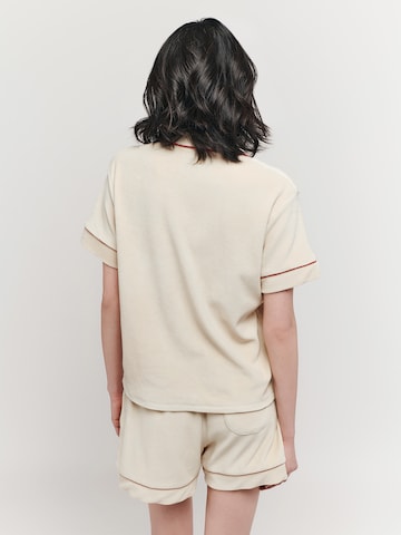 UNFOLLOWED x ABOUT YOU T-shirt 'MEMBER' i beige: baksida
