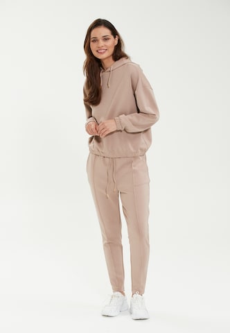 Athlecia Skinny Sports trousers 'Jacey' in Beige