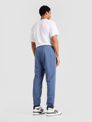 ADIDAS SPORTSWEAR Tapered Urheiluhousut värissä sininen