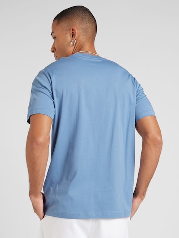Maglietta di Champion Authentic Athletic Apparel in blu