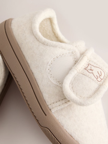 Neonato di Next in beige