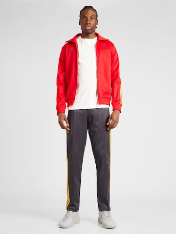 ADIDAS PERFORMANCE - Chaqueta de chándal en rojo