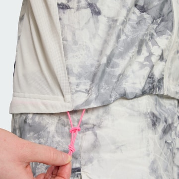Gilet de sport 'Own The Run' ADIDAS PERFORMANCE en gris