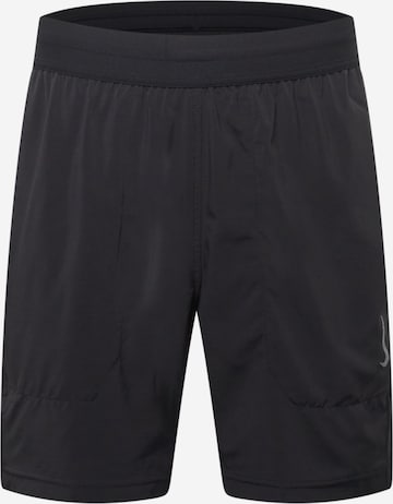 Pantaloni sport de la NIKE pe negru: față