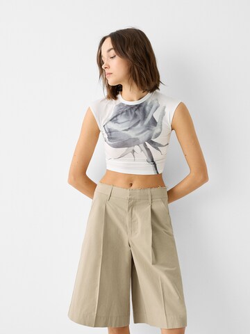 Bershka Wide leg Pleat-front trousers in Beige: front