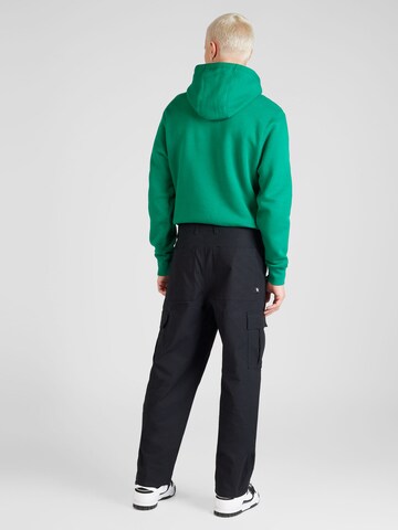 Loosefit Pantaloni cargo 'Club' di Nike Sportswear in nero