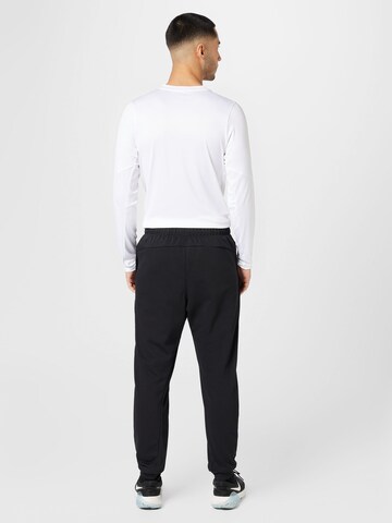 NIKE Tapered Sportbroek in Zwart