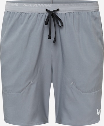 NIKE Workout Pants 'STRIDE' in Grey: front