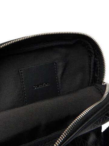Calvin Klein Crossbody bag 'EMBLEM AOP COATED SLIM REPORTER LV04D3334G' in Black