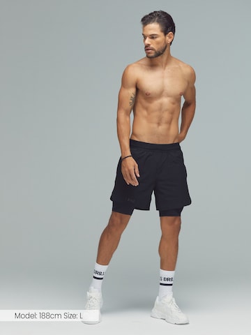 Regular Pantalon de sport 'XFUNCTION 2-in-1 Shorts' DRILLS Apparel en noir