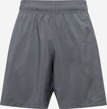 Regular Pantalon de sport UNDER ARMOUR en gris : devant