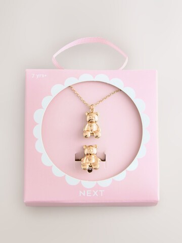 Set de la Next pe auriu