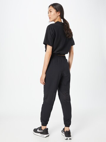 NIKE Tapered Sportbroek in Zwart