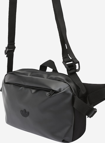 ADIDAS ORIGINALSPojasna torbica 'RIFTA' - crna boja: prednji dio