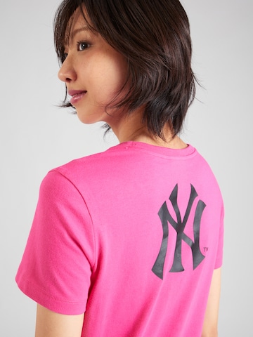 Maglietta di Champion Authentic Athletic Apparel in rosa