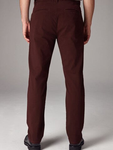 Next Slimfit Chinohousut värissä punainen