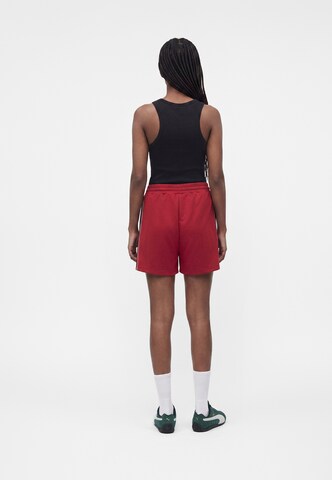 PUMA - Loosefit Calças de desporto 'T7' em rosa