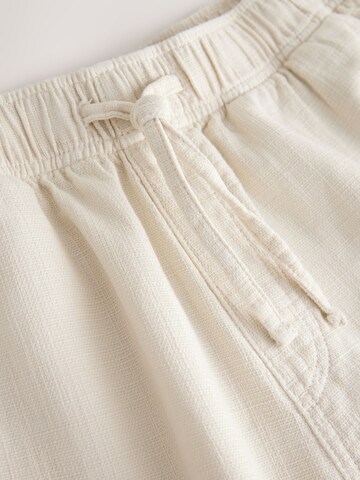 Next Ohlapna forma Hlače | bela barva