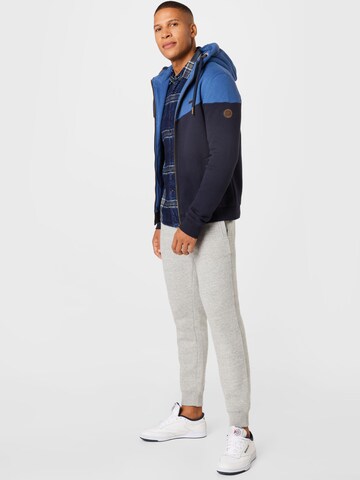 Superdry Tapered Housut värissä harmaa