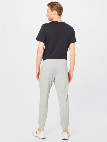 Effilé Pantalon de sport NIKE en gris