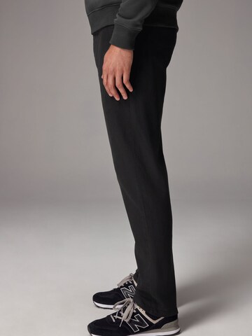 Slimfit Pantaloni chino di Next in nero