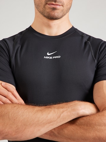 T-Shirt fonctionnel 'NPT' NIKE en noir