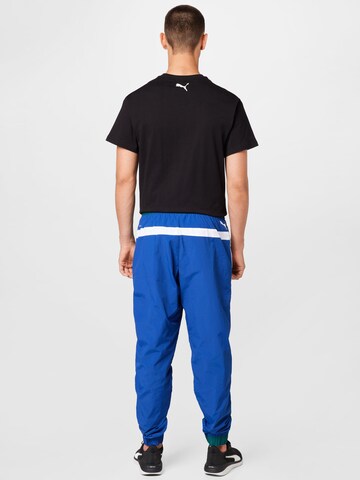 PUMA Tapered Sportbroek 'Clyde' in Blauw