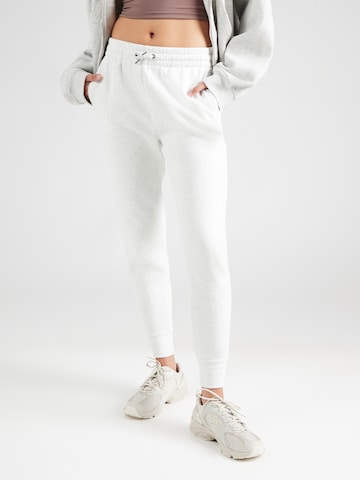UNDER ARMOUR - Tapered Pantalón deportivo en gris: frente