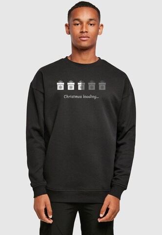 Merchcode Sweatshirt 'Christmas Gifts Loading' in Zwart: voorkant