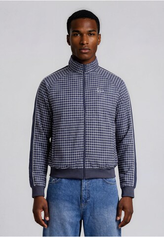 Karl Kani Between-season jacket in Blue: front