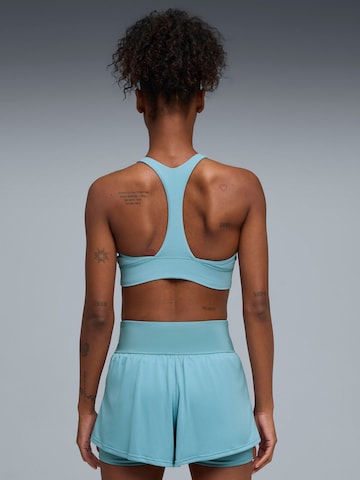 Top sportivo 'Puma Shapeluxe High Neck Bra' di PUMA in blu