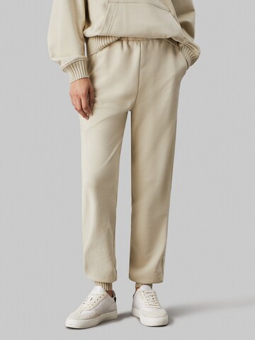 Calvin Klein Jeans Tapered Trousers in Beige: front