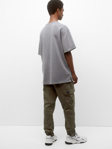 Pull&Bear Tapered Cargo trousers in Green