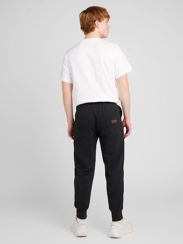 Effilé Pantalon naketano en noir