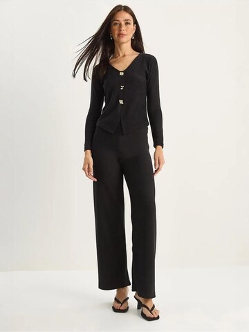 Abito da casa di Bianco Lucci in nero: frontale