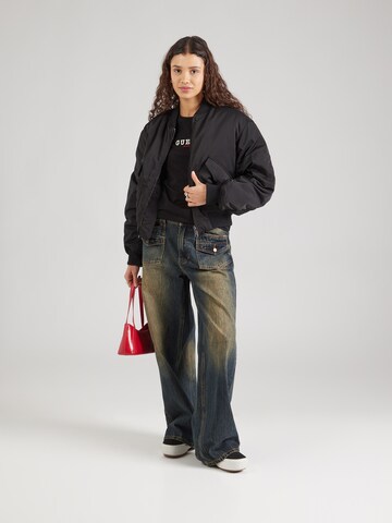 Maglietta di GUESS JEANS in nero