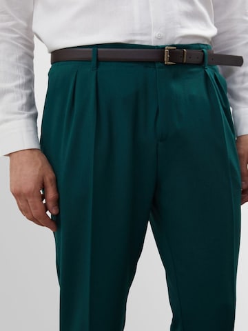 Antioch Tapered Pleat-front trousers in Green