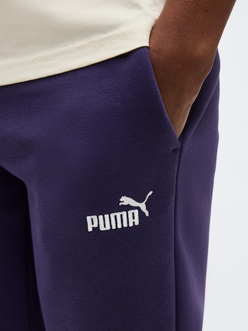 PUMA Tapered Urheiluhousut 'ESS' värissä lila