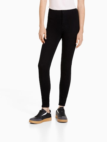 Bershka Skinny Jeggings in Black: front