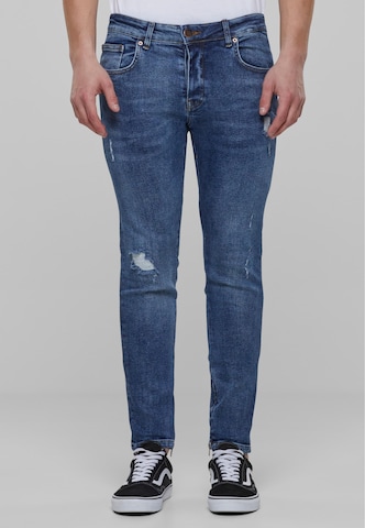 Karl Kani Skinny Jeans in Blue: front